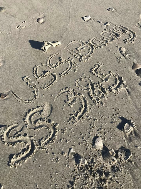 ss385 written in Myrtle Beach sand